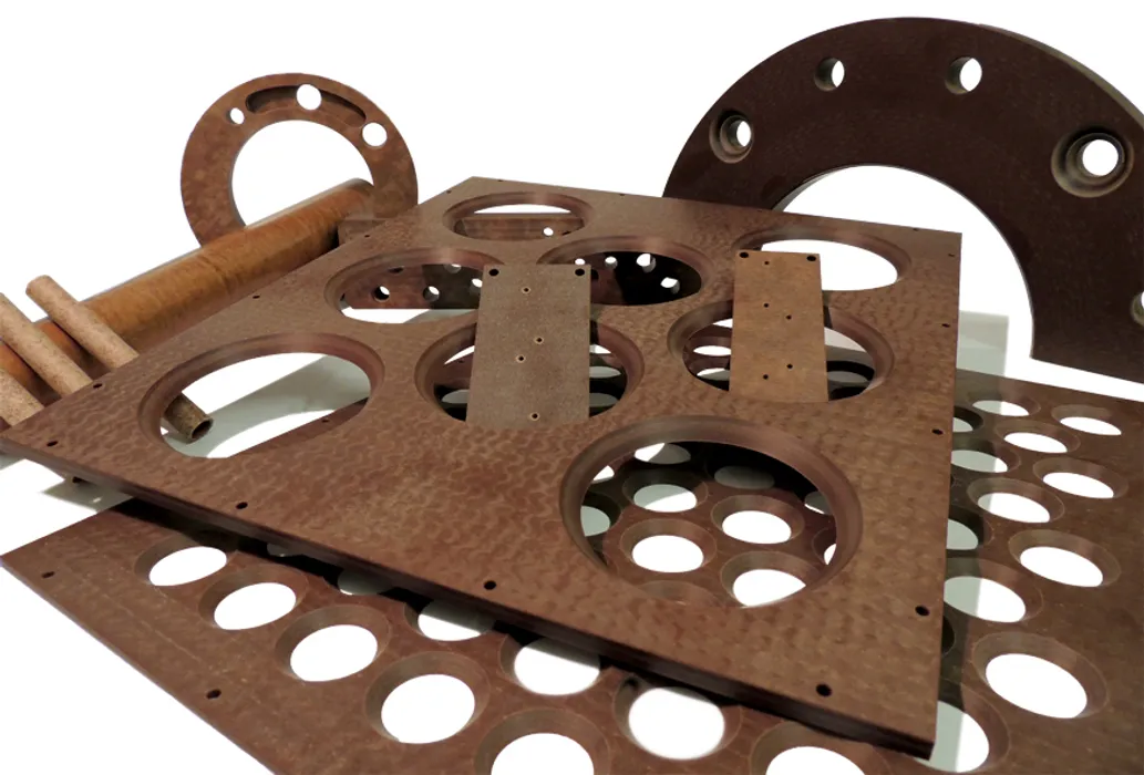 Bild 1:	Pertinax ist bekannt als ein gerne genutzter Werkstoff für die Produktion von Leiterplatten oder robusten Isolierteilen gegen elektrische und thermische Leitung (Urheber: Dr. Dietrich Müller GmbH)